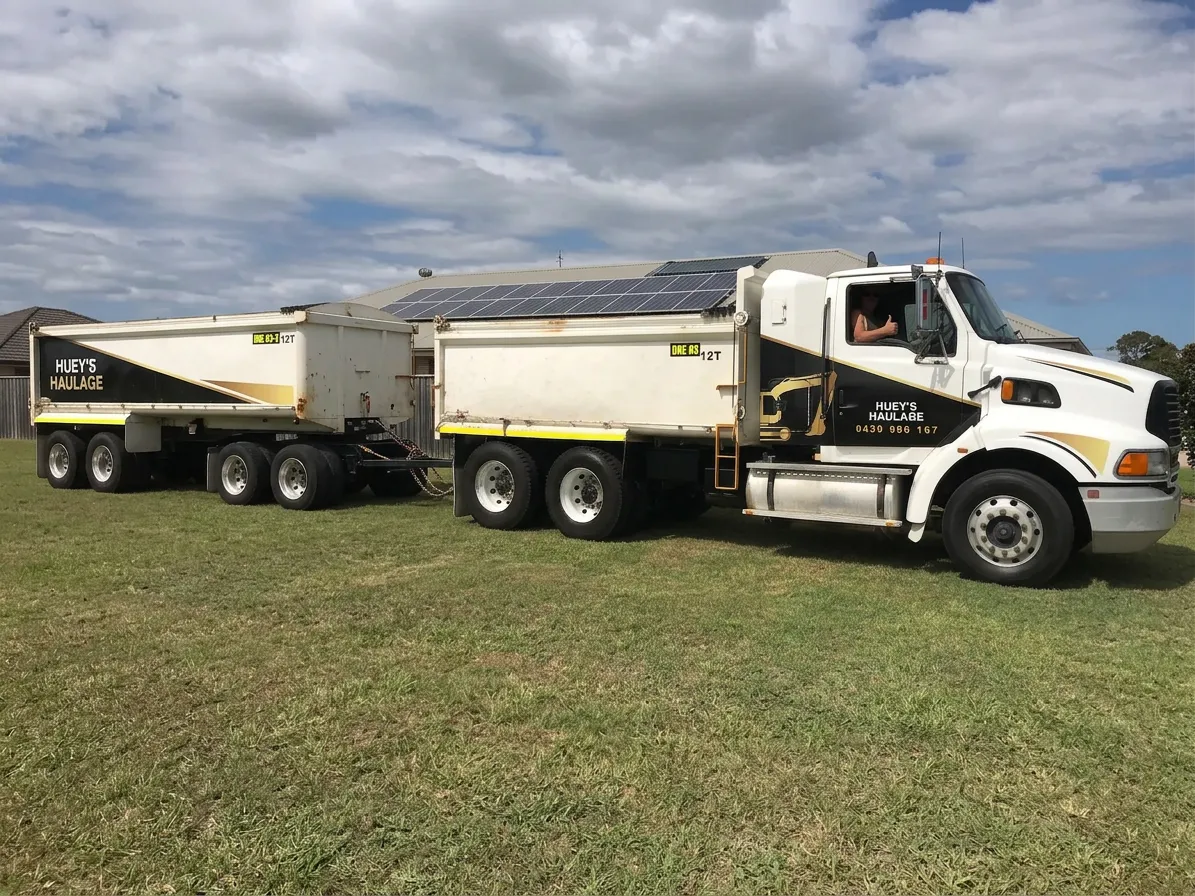 Huey's Haulage truck and dog combination loaded and ready for a bulk cartage run